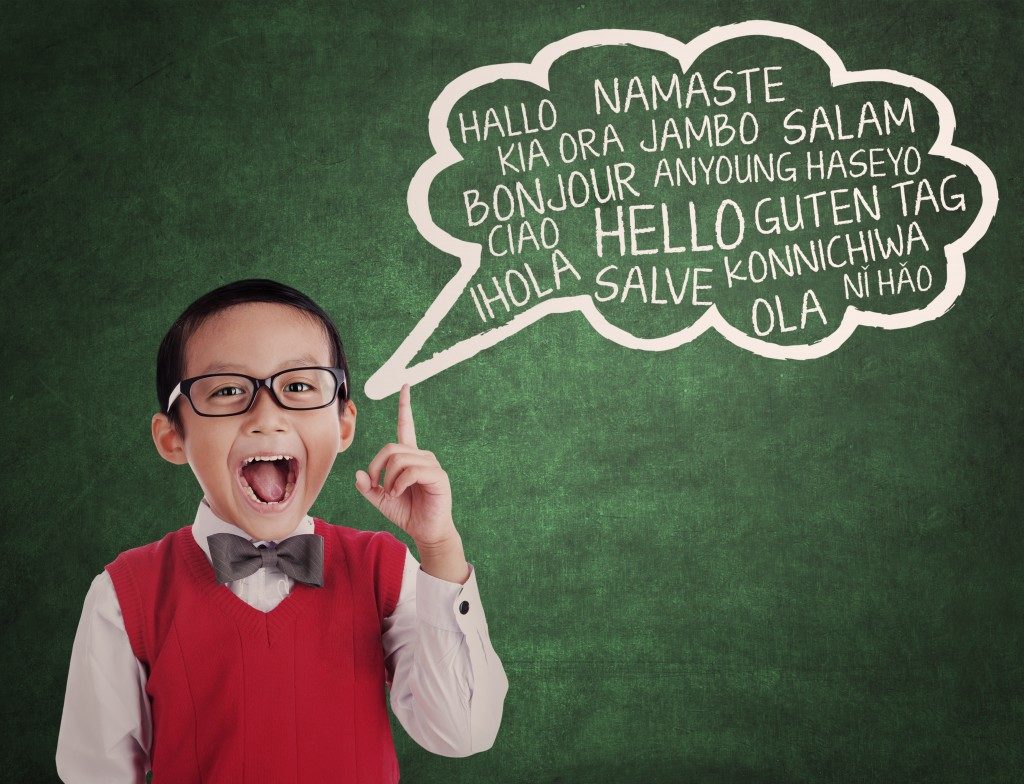 school boy learns to speak different language