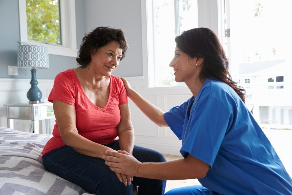woman talking to caregiver
