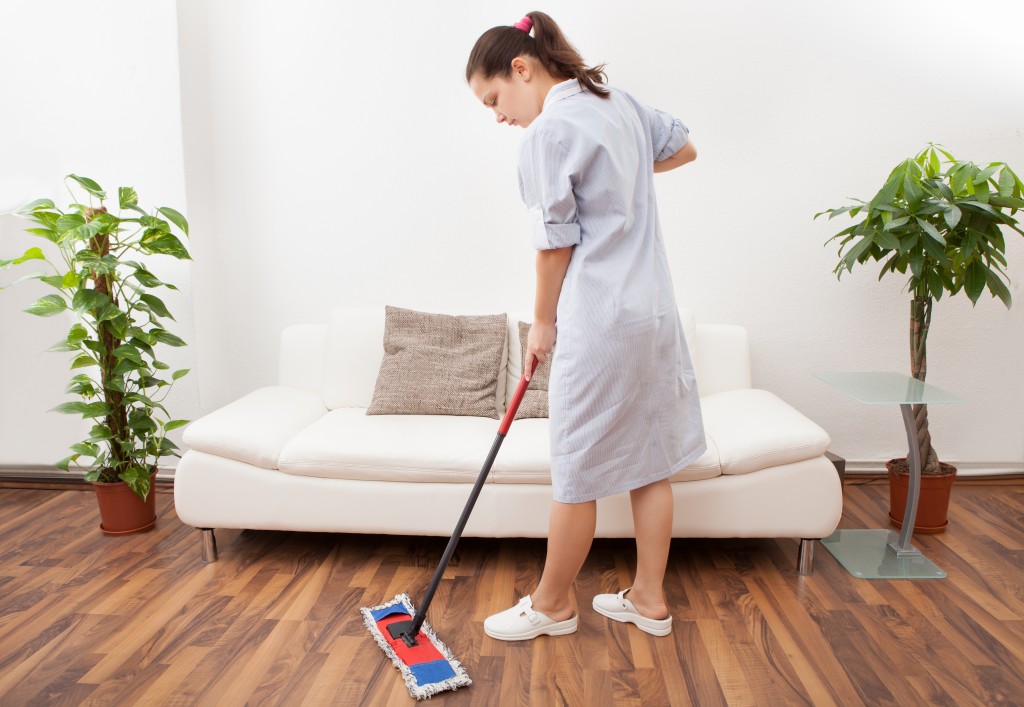 Maid mopping the floor
