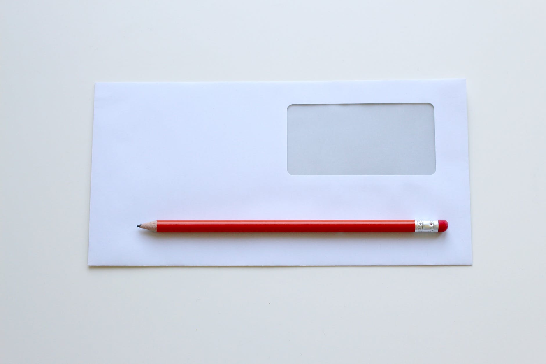 Envelope with red pencil