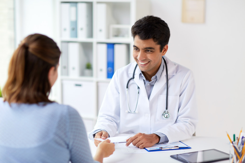 male doctor smiling at patient