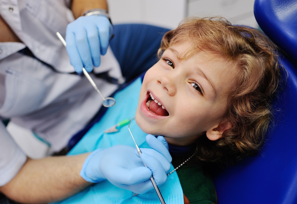 a kid having his dental checkup